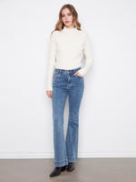 These jeans feature a stylish flare fit, perfect for any casual outing. By Charlie B.