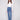 Medium blue jeans featuring a flare leg design and crafted from stretch denim, worn by a model, designed by Charlie B.