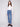 Medium blue jeans featuring a flare leg design and crafted from stretch denim, worn by a model, designed by Charlie B.