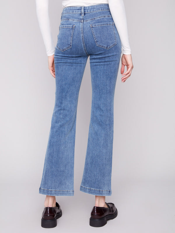 Medium blue jeans showcasing back pockets and a comfortable long length fit, created by Charlie B.