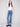 Regular rise medium blue jeans with elegant button accents on the side pockets, designed by Charlie B.