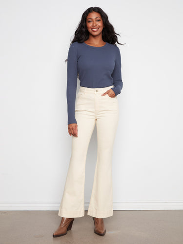 Natural flare leg stretch twill pants featuring a regular rise and five-pocket design by Charlie B.