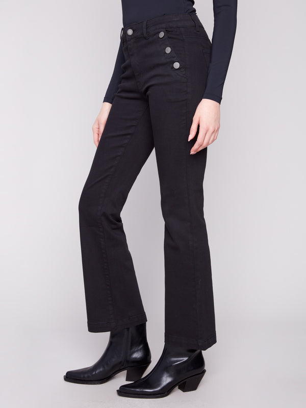 Stylish black pants showcasing button details on side pockets, crafted for a chic look by Charlie B.