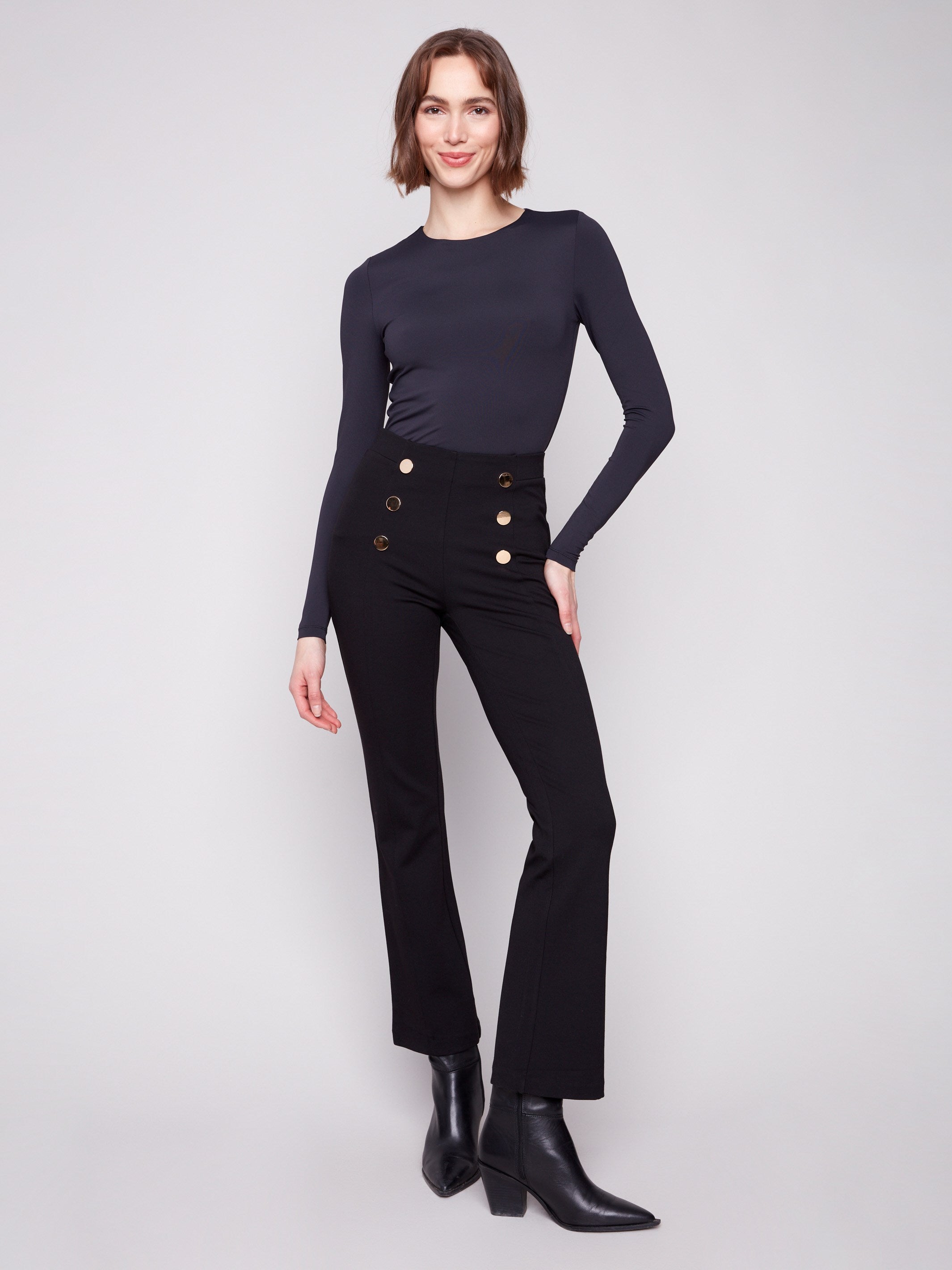 Black ponte pull-on pants featuring a stylish flare design and decorative buttons, perfect for any occasion by Charlie B.