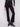 Elegant black pants with an elastic waistband and decorative buttons, crafted from stretch ponte fabric for comfort by Charlie B.