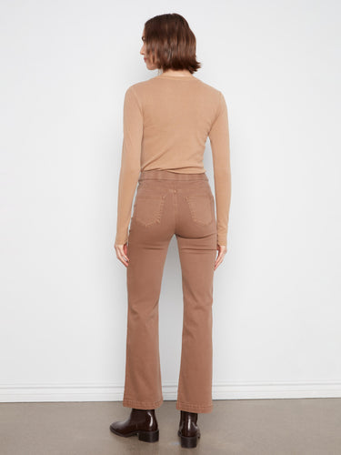 Elegant brown jeans with decorative sailor buttons for added flair by Charlie B.