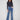 Medium blue jeans with a flare leg and floral embroidery, crafted in stretch denim for comfort by Charlie B.