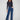 Indigo jeans with a flare fit and floral lace detailing. The stretch denim enhances comfort for everyday wear by Charlie B.