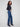 Stretch denim jeans in indigo, showcasing beautiful floral embroidery at the hem for a chic look by Charlie B.