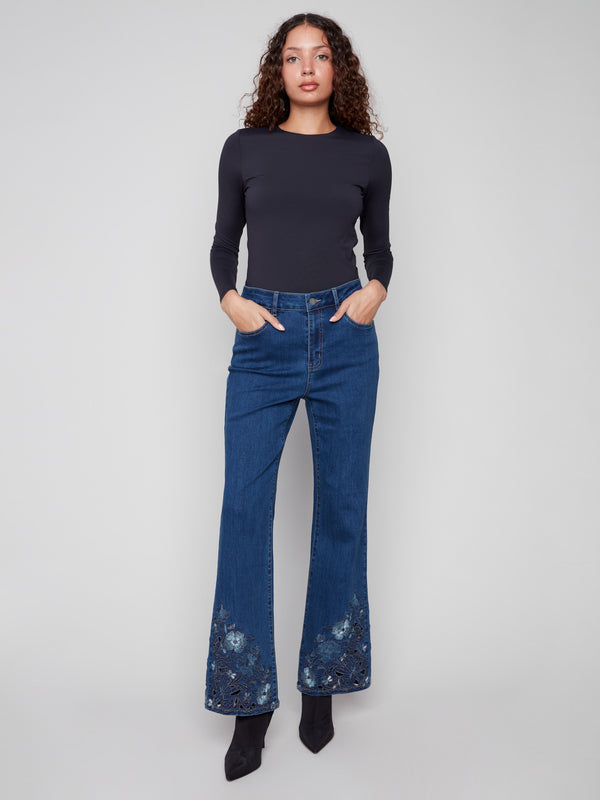 Five-pocket design on these indigo flared jeans adds both style and functionality to your wardrobe by Charlie B.