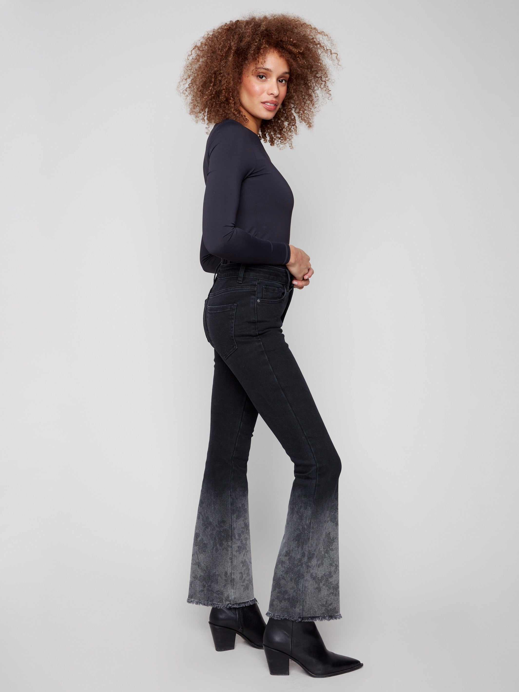 These stylish jeans feature a five-pocket design and regular rise, perfect for versatile wear by Charlie B.
