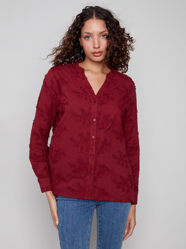 Cabernet blouse with a flattering V-neckline and floral applique, crafted from premium cotton for comfort by Charlie B.