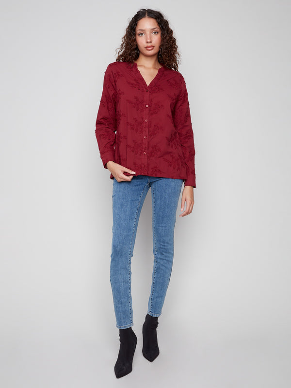 Rich cabernet blouse featuring exquisite applique flowers, made from breathable 100% cotton by Charlie B.