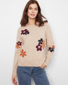 Heather-sand sweater featuring ribbed hem and cuffs with a floral jacquard design adding a touch of elegance by Charlie B.