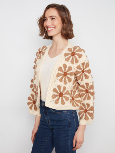 Ecru crochet cardigan featuring an open-front design and long sleeves, highlighted by floral motifs by Charlie B.