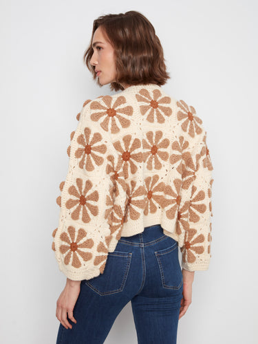 Ecru crochet cardigan in a relaxed fit with intricate floral designs and long sleeves for versatile styling by Charlie B.
