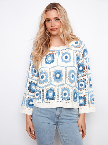 The sweater showcases a stylish boat neckline, adding elegance to its overall look. Perfect for casual outings by Charlie B.