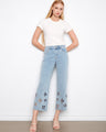 Light blue jeans featuring a regular rise and floral cutouts, crafted in stretch denim for comfort by Charlie B.