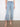 Cropped light blue jeans with a wide leg design and intricate floral cutouts at the hem by Charlie B.