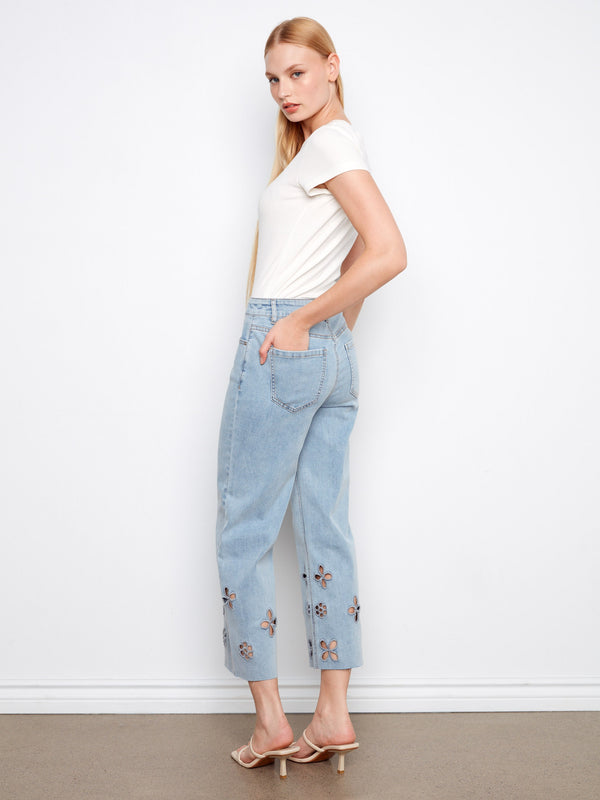 These light blue jeans showcase stretch denim material for added comfort, complete with stylish floral hem details by Charlie B.