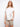 This white cotton tee boasts delicate floral embroidery on the sides by Charlie B.