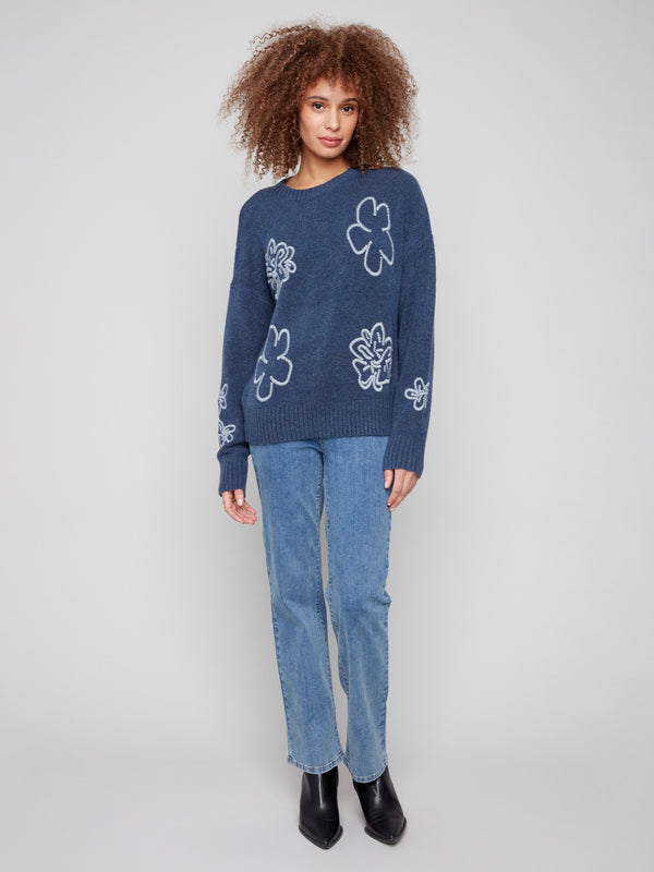 Sweater featuring an embroidered floral design, crafted in heather denim with ribbed cuffs and hem by Charlie B.