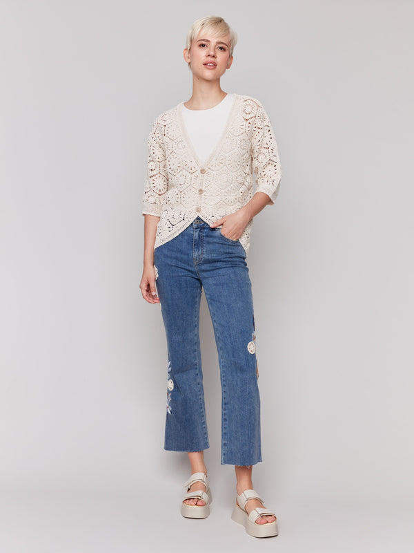 Medium blue jeans crafted from stretch denim material, showcasing a unique style by Charlie B.
