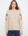 This sweater features a crew neckline, adding a classic touch to the floral embroidery design. By Charlie B.