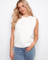 Elegant top with a crew neckline, showcasing delicate floral embroidery and a sleeveless design. Perfect for any occasion. By Charlie B.