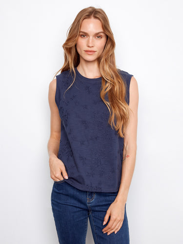 Elegant navy top showcasing exquisite floral embroidery, perfect for any occasion by Charlie B.