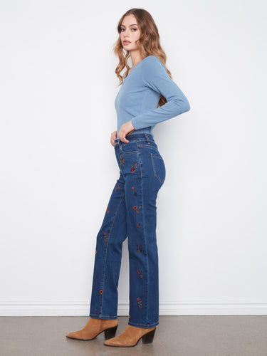 Crafted with stretch denim, these pants provide flexibility and ease of movement while maintaining their shape. By Charlie B.