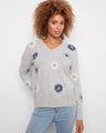 Heather-grey sweater with ribbed cuffs and floral embroidery, perfect for a cozy look by Charlie B.