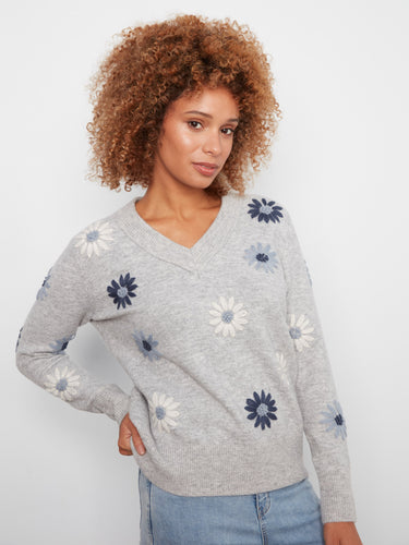 Chic heather-grey sweater with beautiful floral patterns and ribbed hem detailing by Charlie B.
