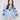 Denim sweater with floral embroidery, showcasing a relaxed fit and ribbed cuffs for comfort by Charlie B.