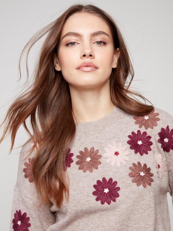 Heather taupe sweater adorned with floral embroidery, showcasing a relaxed fit and ribbed cuffs by Charlie B.