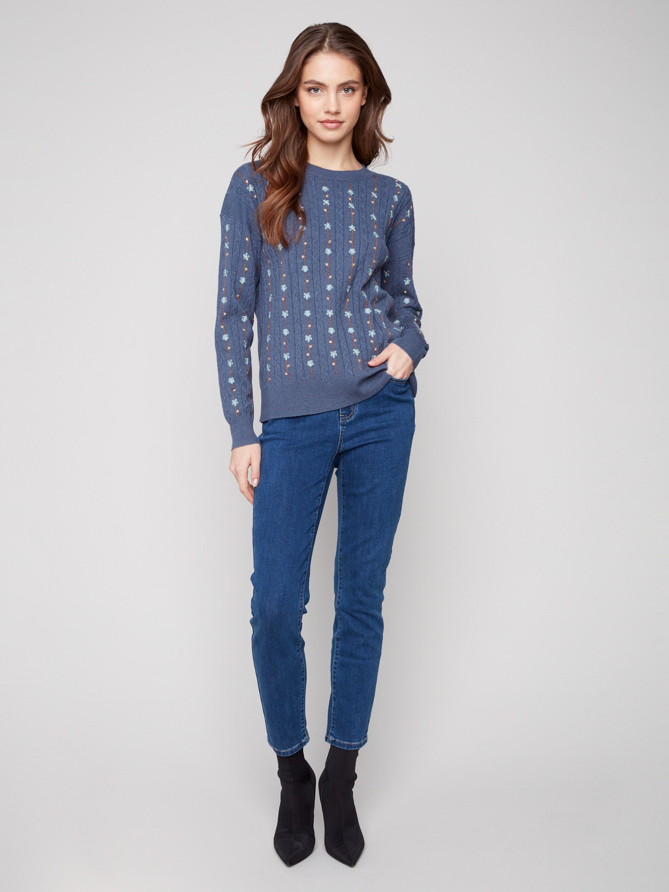 Elegant knit sweater featuring cable plush knit with delicate embroidered florals for a charming touch by Charlie B.