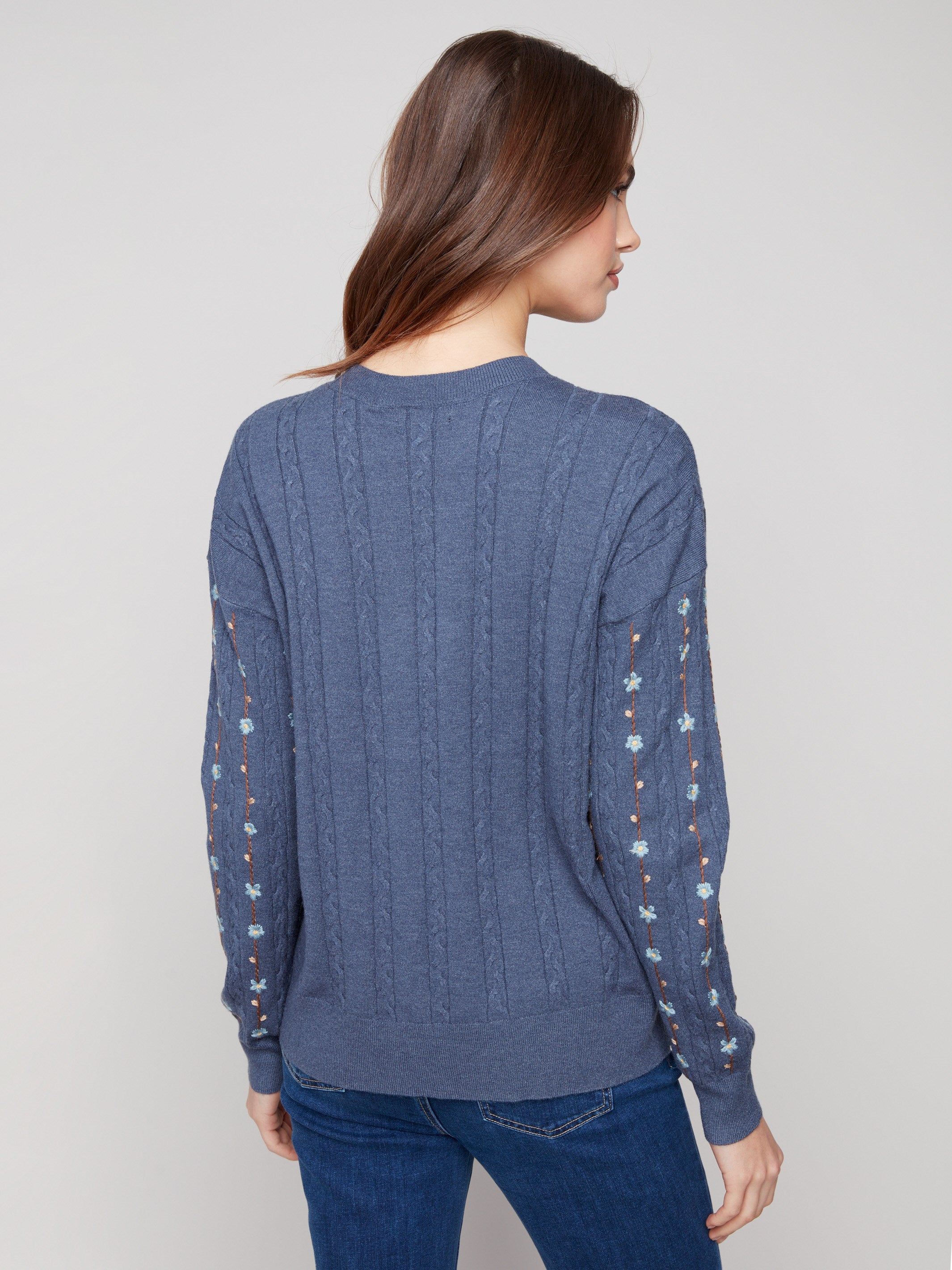 Chic tulip-colored sweater adorned with exquisite embroidered florals and comfortable ribbed cuffs by Charlie B.