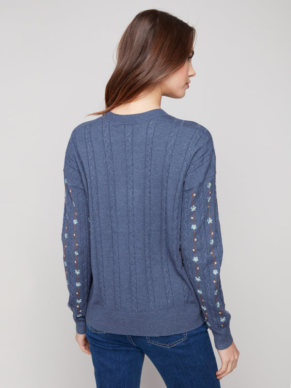 Chic tulip-colored sweater adorned with exquisite embroidered florals and comfortable ribbed cuffs by Charlie B.