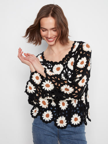 Featuring a scalloped hem, this charming crochet top adds a touch of elegance to any outfit by Charlie B.