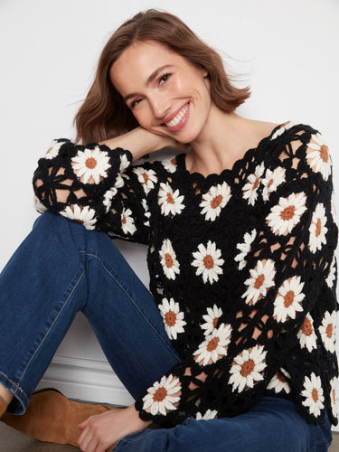 Admire the intricate boat neckline on this exquisite crochet top, making it a standout piece by Charlie B.