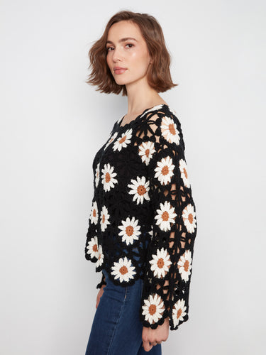 The delicate scalloped hem enhances the feminine appeal of this lovely crochet design by Charlie B.
