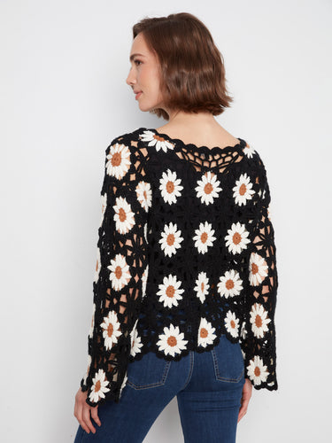 Enjoy the comfort and style of long sleeves with this beautifully crafted crochet top by Charlie B.