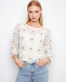 Floral crochet sweater with elegant boat neckline and delicate design. Perfect for a stylish day out by Charlie B.