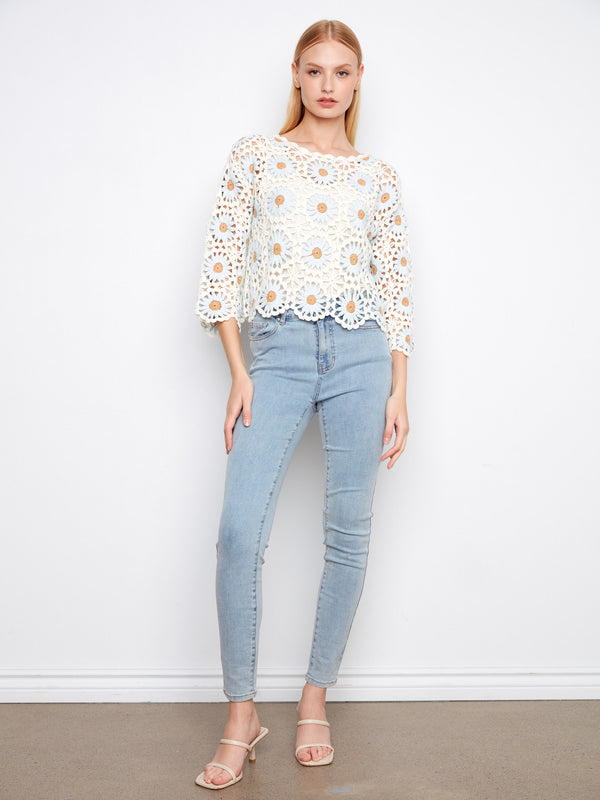Charming white floral crochet sweater featuring a handcrafted design, ideal for casual elegance by Charlie B.