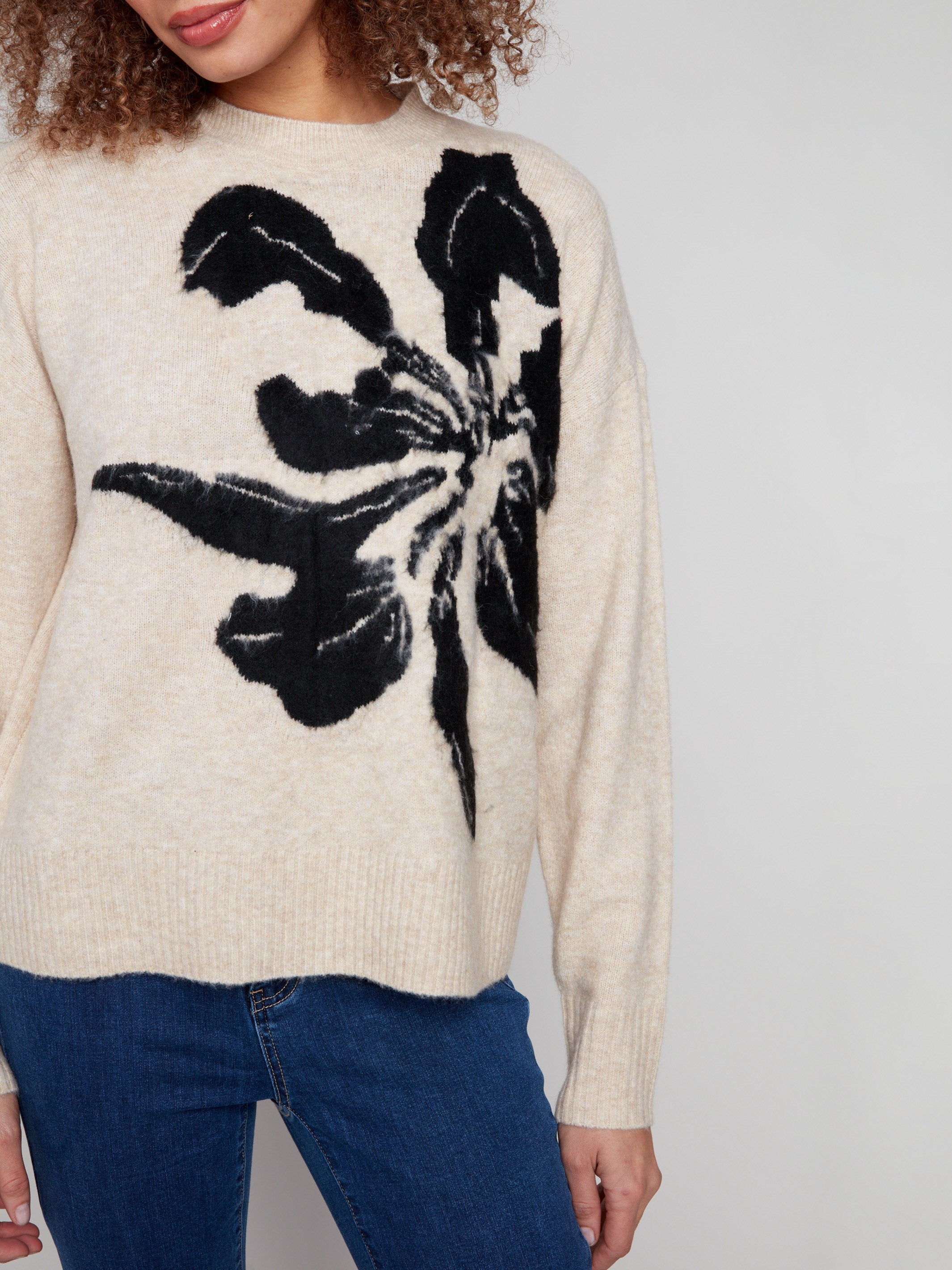 Stylish beige sweater with drop shoulders and an eye-catching floral design for a chic look by Charlie B.