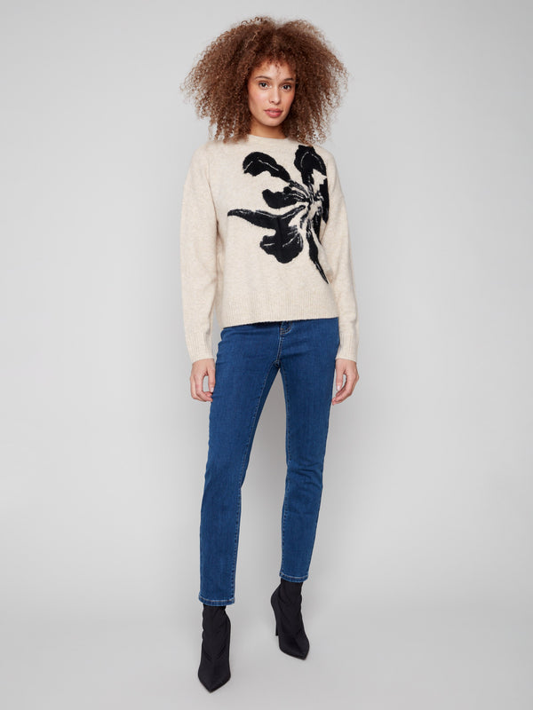 Elegant crew neck sweater in beige with a unique abstract floral pattern, ideal for cool weather by Charlie B.