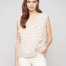 Sleeveless design with floral mesh adds elegance to this sweater vest by Charlie B.