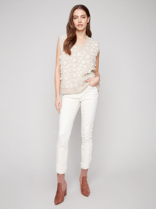 Embrace the drop shoulder design of this charming floral mesh sweater vest by Charlie B.