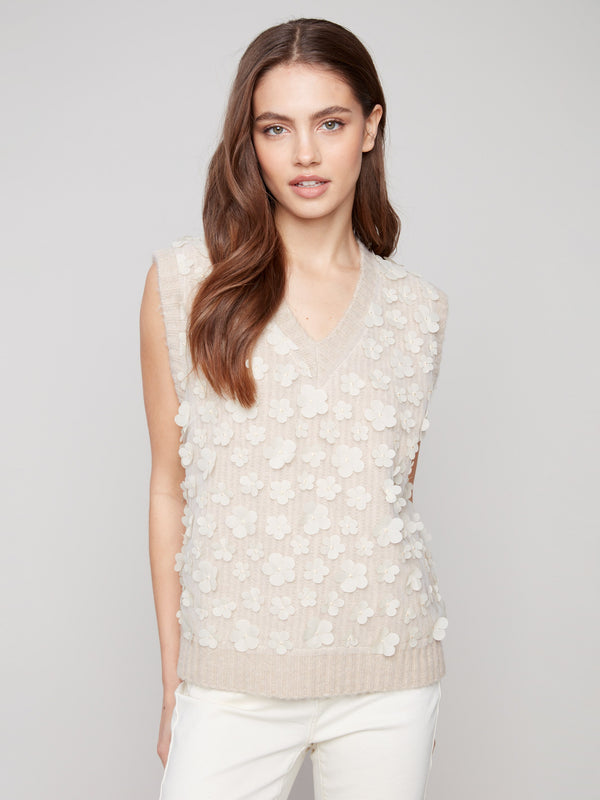 Heather oat tone enhances the floral mesh and drop shoulder style of this vest by Charlie B.