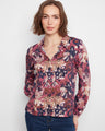 Floral blouse with a stylish shirt collar, offering a touch of elegance to any outfit by Charlie B.